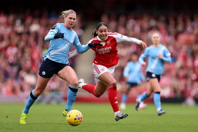 Olivia Smith and Rebecca Knaak battle for possession
