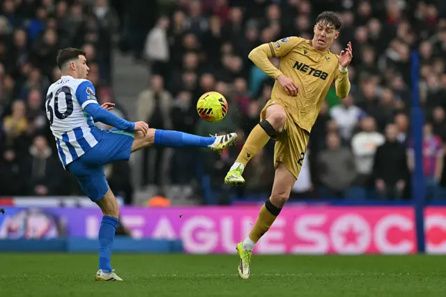 Brighton's German midfielder #30 Pascal Gross (L) vies with Crystal Palace's Norwegian striker #22 Jorgen Strand Larsen (R) during the English Premier League football match between Brighton and Hove Albion and Crystal Palace at the American Express Community Stadium in Brighton, southern England on February 8, 2026.