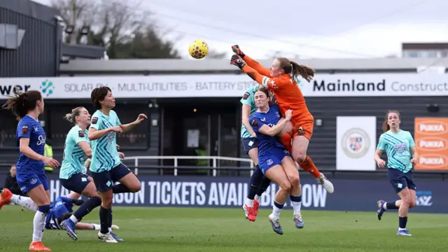 Courtney Brosnan clears the ball with a punch