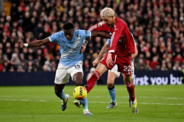 Marc Guehi of Manchester City is challenged by Hugo Ekitike of Liverpool during the Premier League match between Liverpool and Manchester City at Anfield on February 08, 2026 in Liverpool, England.