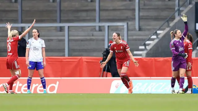 Martha Thomas celebrates