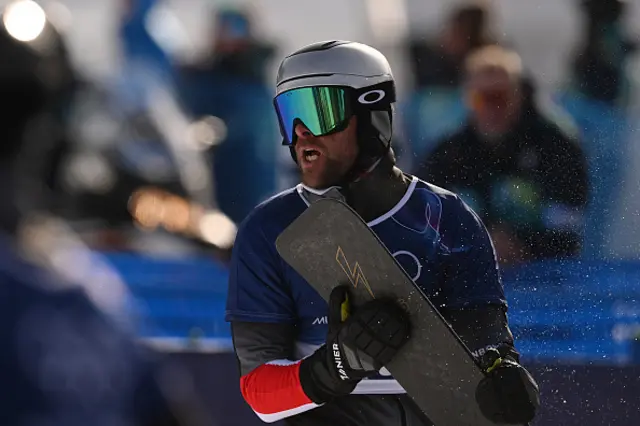 Austria's Benjamin Karl reacts in the snowboard men's parallel giant slalom