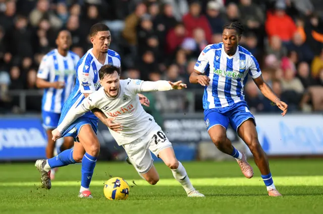 Swansea City's Liam Cullen is fouled