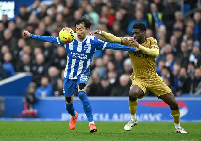 Kaoru Mitoma of Brighton & Hove Albion is challenged by Jefferson Lerma of Crystal Palace during the Premier League match between Brighton & Hove Albion and Crystal Palace at Amex Stadium on February 08, 2026 in Brighton, England.