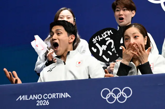 Japan's Riku Miura (front R) and Japan's Ryuichi Kihara (front L) react