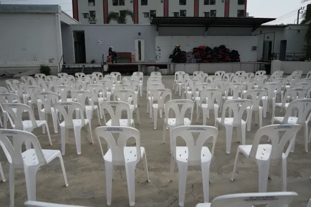 Empty chairs arranged neatly at the People's Party headquarters in Bangkok
