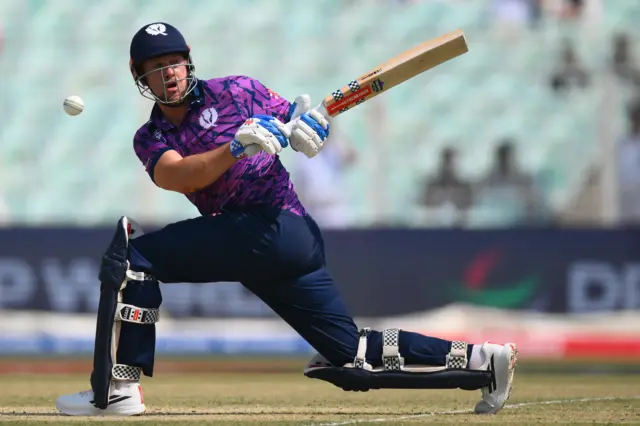 George Munsey reverse sweeps for Scotland in their World Cup match against Italy