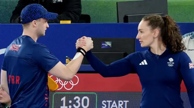 Bruce Mouat and Jen Dodds shake hands