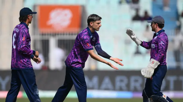 Scotland celebrate the wicket of JJ Smuts