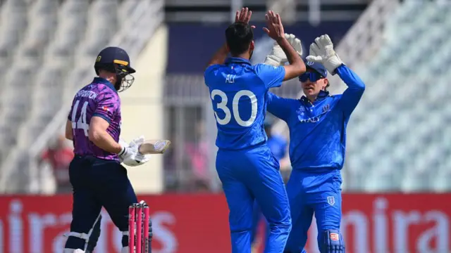 Richie Berrington walks off as Italy celebrate