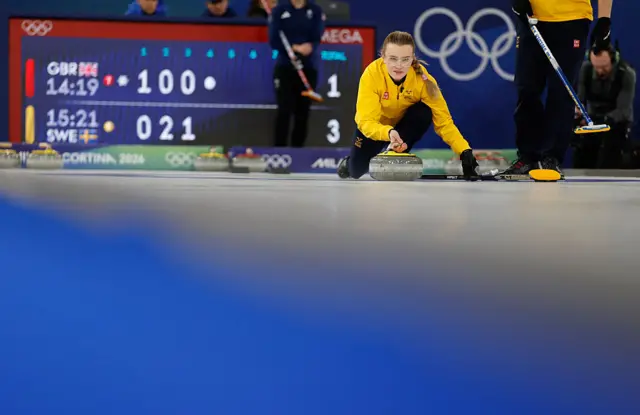 Sweden's Isabella Wranaa competes in the curling mixed doubles round robin semi-final between Great Britain and Sweden