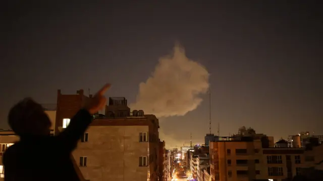 Smoke rises following an explosion in Tehran