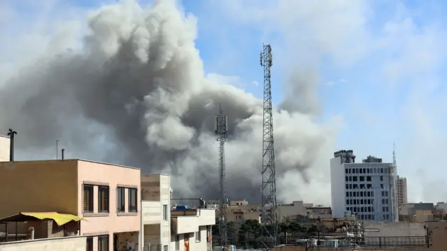 Smoke rises in central Tehran after an Israeli attack