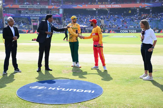Aiden Markram of South Africa and Sikander Raza of Zimbabwe interact ahead of the ICC Men's T20 World Cup India & Sri Lanka 2026 Super 8 match between Zimbabwe and South Africa at Arun Jaitley Stadium