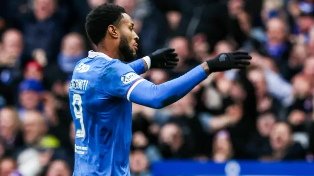 Youssef Chermiti celebrates after scoring for Rangers against Celtic