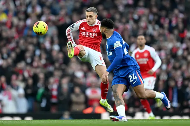 Leandro Trossard of Arsenal passes the ball whilst under pressure