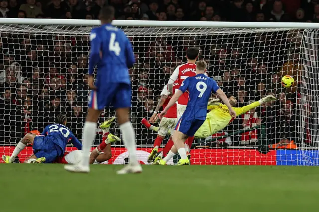 David Raya (back R) makes a save