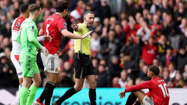 Referee Chris Kavanagh reacts