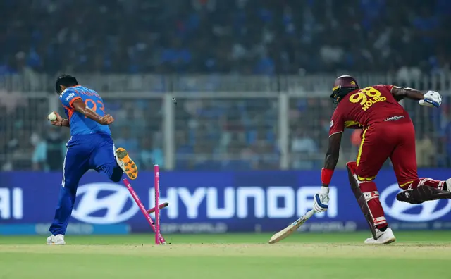 Jasprit Bumrah attempts to run Jason Holder out