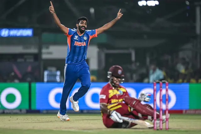 ndia's Jasprit Bumrah (L) celebrates after taking the wicket of West Indies' Shimron Hetmyer (bottom) during the 2026 ICC Men's T20 Cricket World Cup Super Eights match between India and West Indies at the Eden Gardens in Kolkata