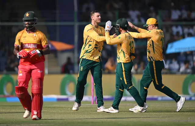 George Linde of South Africa celebrates the wicket of Dion Mayers of Zimbabwe during the ICC Men's T20 World Cup India & Sri Lanka 2026 Super 8 match between Zimbabwe and South Africa at Arun Jaitley Stadium