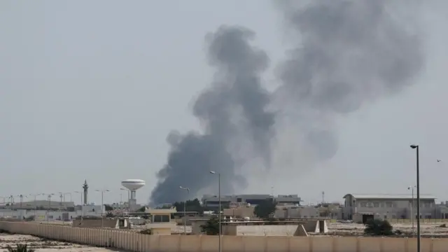 Smoke rises after reported Iranian missile attacks, following United States and Israel strikes on Iran, as seen from Doha, Qatar.