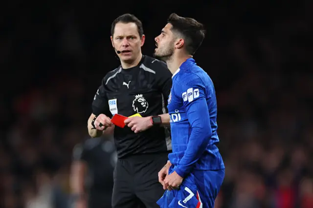 Pedro Neto of Chelsea is shown a red card