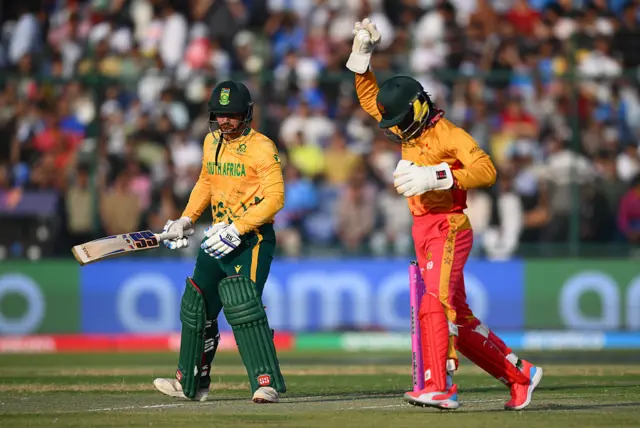 Tadiwanashe Marumani of Zimbabwe celebrates the wicket of Quinton de Kock of South Africa during the ICC Men's T20 World Cup India & Sri Lanka 2026 Super 8 match between Zimbabwe and South Africa at Arun Jaitley Stadium