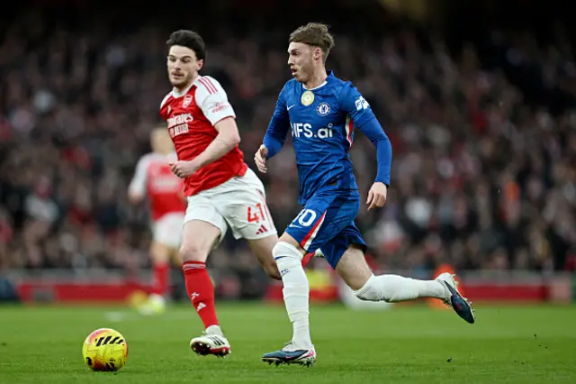 Cole Palmer of Chelsea runs with the ball whilst under pressure