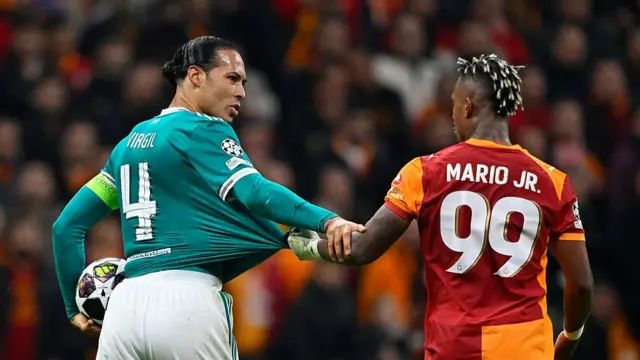 Liverpool's Dutch defender #04 Virgil van Dijk (L) and Galatasaray's Gabonese midfielder #99 Mario Lemina