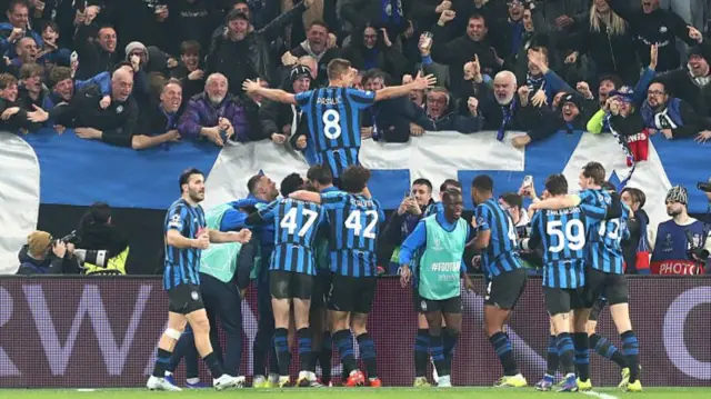 Atalanta celebrate their stoppage-time tie-winner against Dortmund