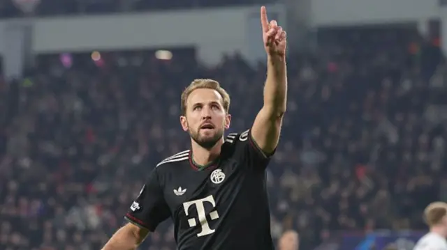 Harry Kane pointing one finger to the sky during a goal celebration