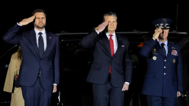 U.S. Vice President JD Vance, Secretary of Defense Pete Hegseth and Chairman of the Joint Chiefs of Staff Dan Caine salute during a dignified transfer of the remains of U.S. Army Sgt. Benjamin Pennington, who died on March 8 from injuries sustained during a March 1 attack at Prince Sultan Air Base in Saudi Arabia, at Dover Air Force Base in Dover, Delaware, U.S., March 9