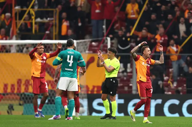 Virgil Van Dijk argues the decision with the referee