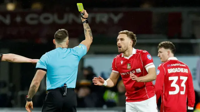 Sam Smith shown a yellow card