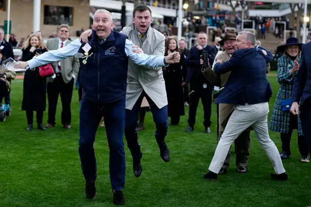 The owners of Holloway Queen celebrate victory in The National Hunt Challenge Cup Novices' Handicap Chase