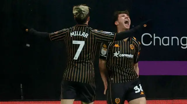 Lewis Koumas celebrates scoring