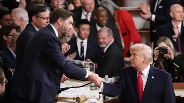 JD Vance and Donald Trump shaking hands following State of the Union address
