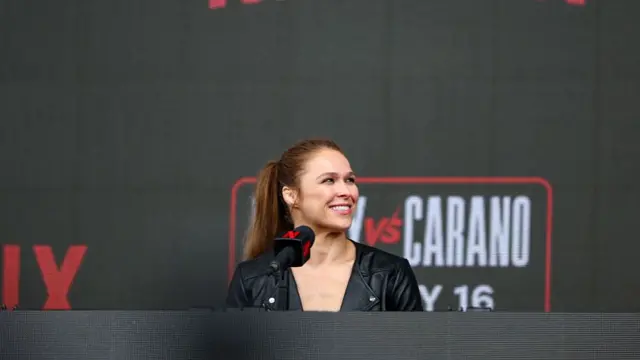 Ronda Rousey smiles at a news conference