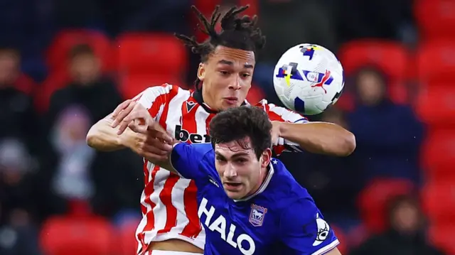 Stoke's Ashley Phillips challenges for the ball against Ipswich