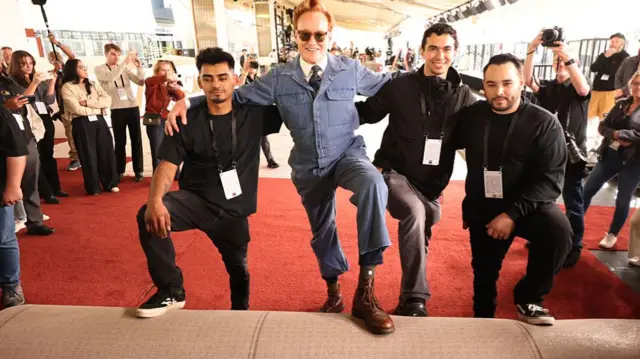Conan O'Brien poses with the crew during the 98th Oscars red carpet roll out at Ovation Hollywood