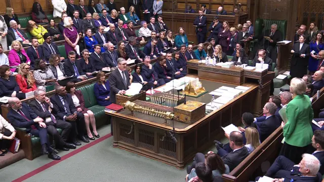 Keir Starmer speaking to a tightly packed House of Commons