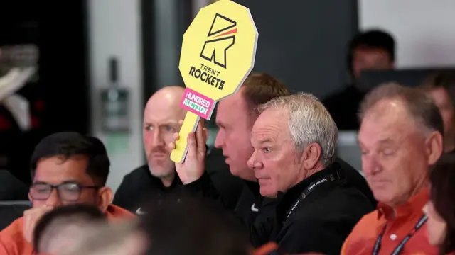 : Mick Newell of Trent Rockets places a bid
