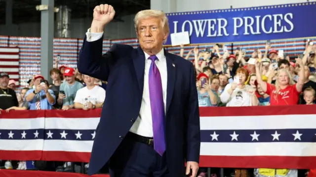 US President Donald Trump gestures during a visit to Verst Logistics in Hebron, Kentucky, US