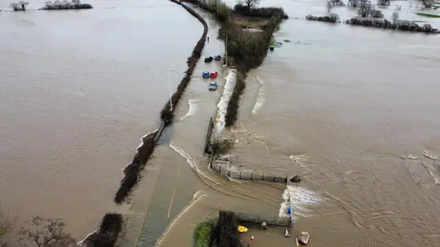 Drone stills of flooding in Axminster, Devon, caused by Storm Chandra