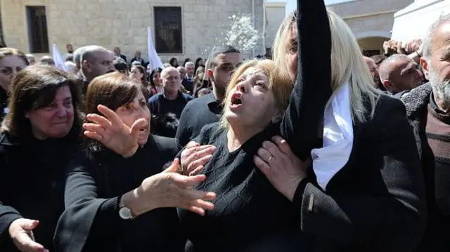 Residents of the Christian Lebanese border village of Qlayaa mourn during the funeral of their village's priest, Father Pierre al-Rahi on March 11, 2026.