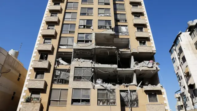 A damaged apartment building in the aftermath of an Israeli strike in Beirut