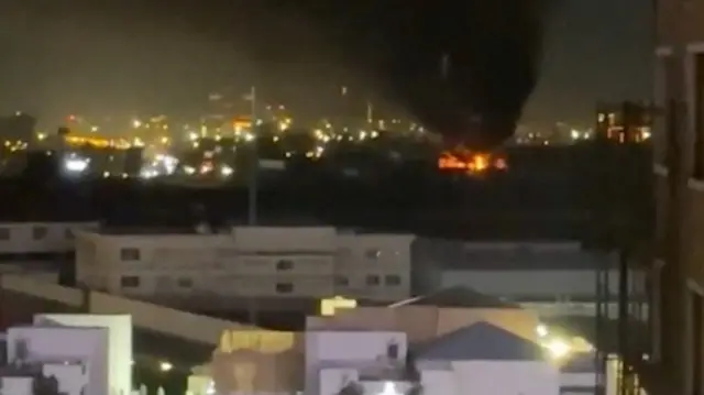 This picture from Monday shows smoke and flames rising following a drone attack on the UAE consulate in Erbil
