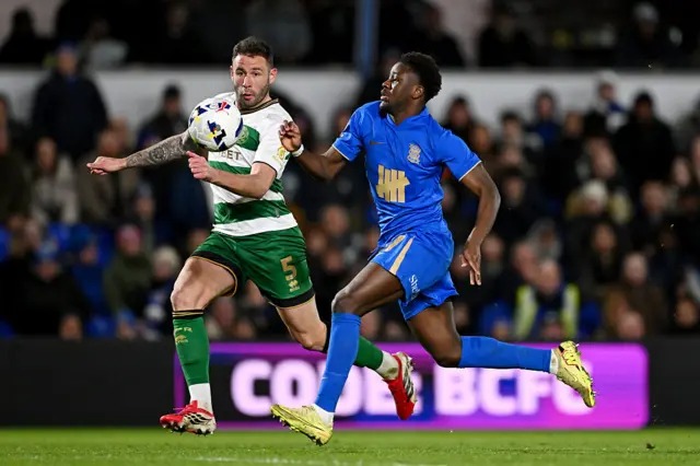 Steve Cook of Queens Park Rangers battles for possession with Ibrahim Osman of Birmingham City
