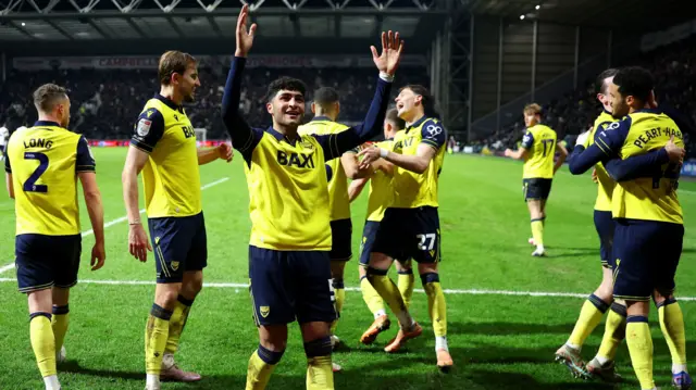 Oxford United players celebrate a goal in their 3-1 win at Preston last time out